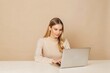 © Hussein - freelance data entry specialist, young woman typing, clean workspace, neutral tones, soft lighting, realistic