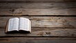 © naphat - High resolution images An open Bible on an old wooden table, symbolizing the bible as your pc wallpaper background. The scene is captured from above with a flat lay perspective, emphasizing the