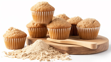 Wall Mural - Fluffy muffins on a wooden board, accompanied by a heap of baking flour.