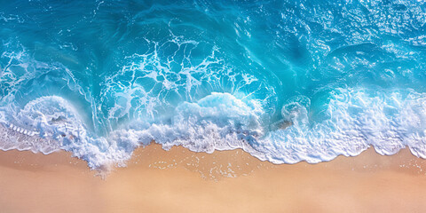 Aerial top down view of ocean waves on the beach, a beautiful natural summer vacation holidays background