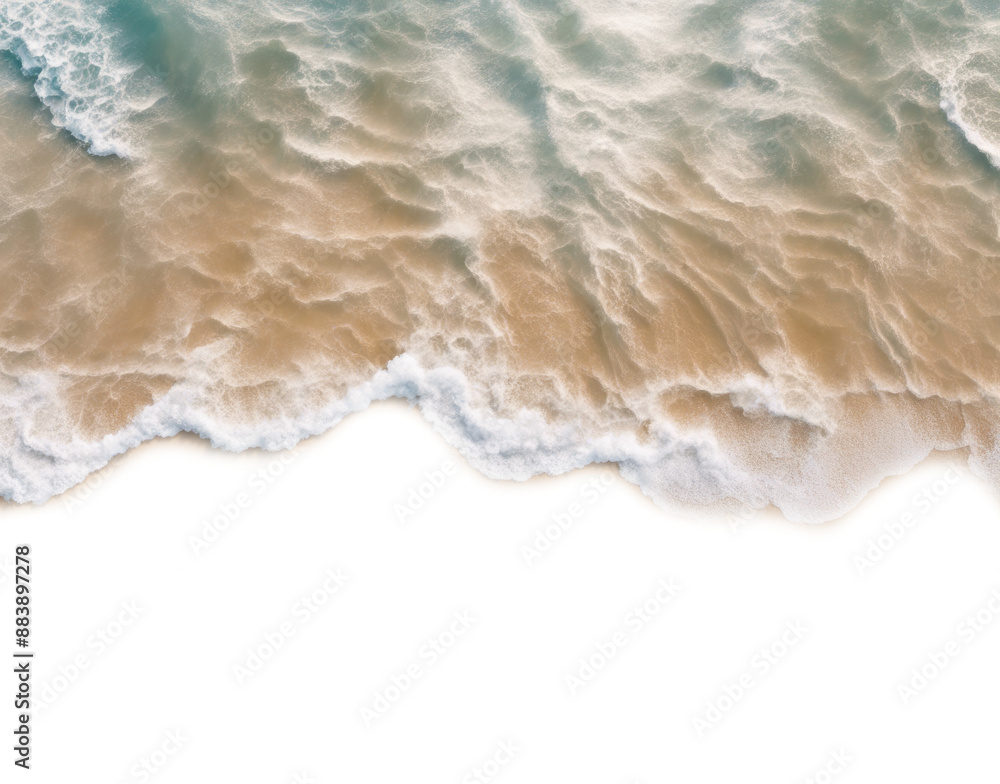 Aerial view of ocean waves gently crashing onto a sandy beach shore ...