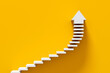 © Cagkan - White stairs leading to an arrow pointing up on yellow background