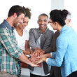 © ArcursPI/peopleimages.com - Portrait of man, business people and hand stack in office for success, celebration and smile. Meeting, partnership and team building or group for project, achievement or pride and diversity in agency