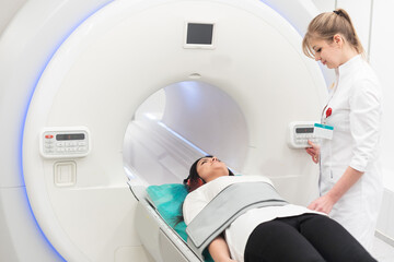 Female patient undergoing MRI - Magnetic resonance imaging in Hospital. Medical Equipment and Health Care