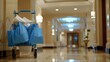 © Leli - A blue cart filled with white towels sits in a hotel hallway