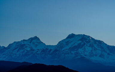 landscape view of snow covered mountain range in nepal.