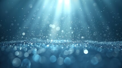 Wall Mural - the image is of a blue ocean with a lot of light shining on it