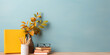 © syhin_stas - Books, glasses, pencils, vase with autumn leaves on the background of an empty blue wall on a wooden table. Demonstration and presentation of the product. Back to school. Copy space. Mock up. Banner