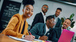 © wonder - Smiling African businesswoman in a meeting with her team.