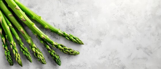 Wall Mural -  Two bunches of green asparagus on the table