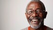 © addymawy - Portrait of a joyful senior man with grey hair and beard wearing glasses, expressing happiness and warmth.