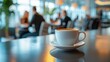 © addymawy - Blurred background of coffee shop with a cup of coffee in the foreground