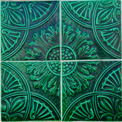 Traditional ornated portuguese ceramic tiles (azulejo) with beautiful old flower ornaments, classic floral decoration and colorful green art pattern in retro style