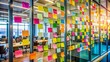 © Man888 - Vibrant colored sticky notes blurred on a glass wall, creating a creative chaos, symbolizing innovative ideas and collaborative thinking in a modern office setting.