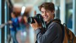 © Iryna - Teen photographer capturing school news: Smiling teenage boy with a camera in hand, taking photos for the school newspaper. Represents youth journalism, education, and student activities