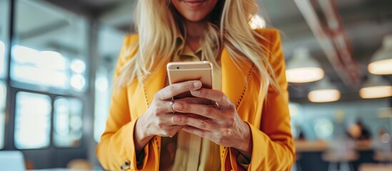 Sticker - Woman in Yellow Blazer Uses Smartphone in Office