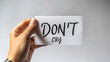 © CozyDigital - Don`t Cry. The inscription on white sheet of paper. Emotional outburst