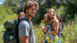 © Nataliya - A telephoto angle photo of first-year students on a nature hike, engaging in conversations while exploring, with copy space