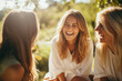 © Janire Fernández - Three Young Women Laughing Together in a Park, Enjoying Outdoor Leisure and Fresh Air in a Joyful and Carefree Moment