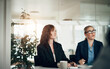 © Flamingo Images - Businesswomen listening during a meeting together in an office boardroom