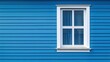 © Johannes - A blue house with a white window and a white window