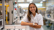 © Elena - A smiling teenage intern in a lab coat stands by a machine, leaning on it with her arms crossed. Youthful enthusiasm and confidence in a high-tech industrial environment.
