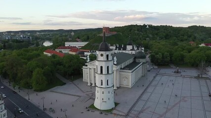 Canvas Print - Bell Tower in Vilnius Old Town in Lithuania. Gediminas Castle, Cathedral and Bell Tower in Background. Hill of Three Crosses.