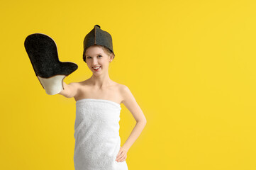 Sticker - Young woman in sauna hat with massage glove on yellow background