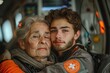 © IULIIA SAVINA - A young medical man hugs an elderly woman.