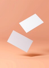 Wall Mural - mockup of white blank business cards floating on peach background