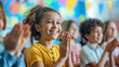 © Laura - A class applauding a student’s achievement, supportive and joyful, upper third copy space