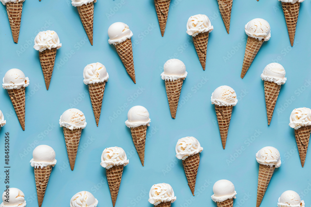 Seamless pattern of vanilla ice cream cones on a blue background ...