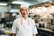 © CojanAI - Portrait of a smiling middle aged male chef in kitchen
