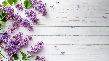 Poster - Lilac flowers on white wooden background in spring Top view with empty space