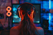© Antonio Diaz - Gamer girl wearing headphones playing on a powerful personal computer at home at night