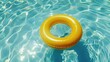 © pinporn manosri - Yellow pool ring floating in a clear blue swimming pool, inviting a relaxing and refreshing swim.