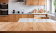 © Hendra - Empty wooden table and blurred kitchen background. food design background