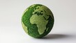 © Suryani - World globe made of green grass representing nature and environmental conservation