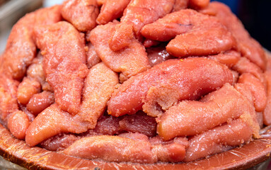 Sticker - Close-up of stacked pollack roe in red rubber basin for sale at a fish market of Changwon-si, South Korea
