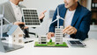 © laddawan - ESG concept of environmental, Green ethical business preserving resources, reducing CO2, Business person team working on laptop virtual smartphone