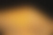 © malshak_off - Grainy textured abstract background with a black to gold gradient blend