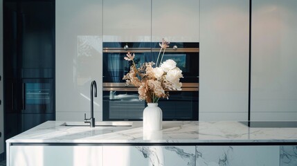 Wall Mural - A minimalist kitchen with a polished marble countertop, high-end appliances, and a single vase of fresh flowers on the island