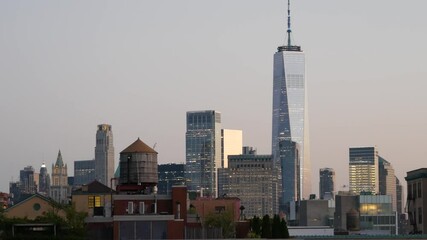 Wall Mural - New York City Manhattan downtown skyline cityscape. Financial district rooftop view from Chelsea, Midtown. Buildings roofs. urban architecture, United States. World Trade Center and water tower tank.