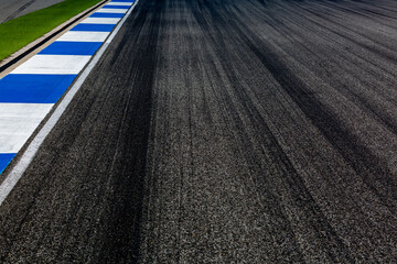 Wall Mural - Asphalt race track with black tire mark texture and background, Abstract asphalt road race track background , Tire mark on race track texture and background.