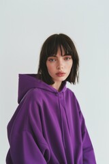 Wall Mural - Young woman wears blank purple hoodie mockup photography portrait fashion.