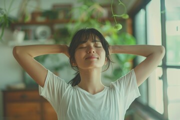 close up of a woman in a yoga position with closed eyes, clasped hands and raised arms performing the sun salutation flow - healthy lifestyle and meditation concept