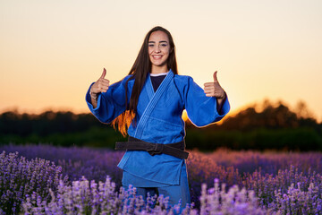 Poster - Black belt judoka in a lavender field