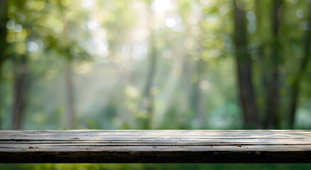 Sticker - In a green forest, a wooden table stands, surrounded by tall trees blurred background.