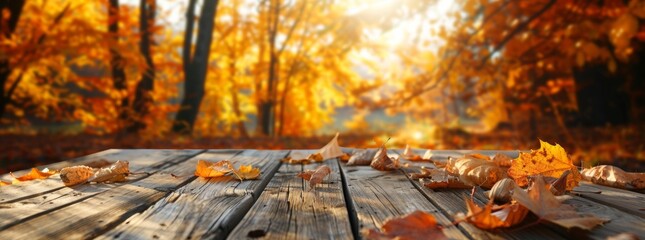 Wall Mural - Autumn background with wooden table and blurred autumn forest in the background.