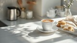 A minimalist white kitchen table featuring coffee cups with different brews.

